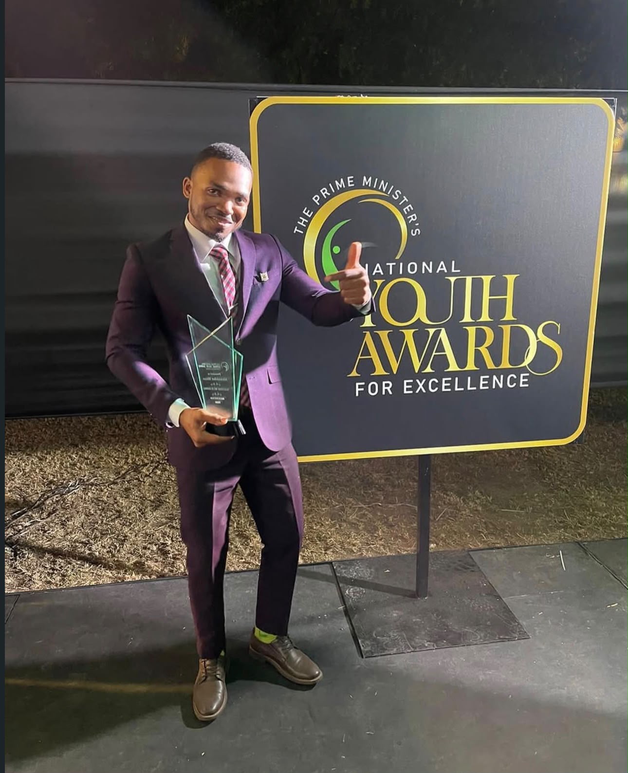 Mr. Shaw with the 2022 Prime Minister's National Youth Award for Excellence
